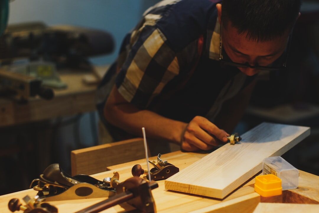 Danish craftsman shaping wood in a small rural workshop