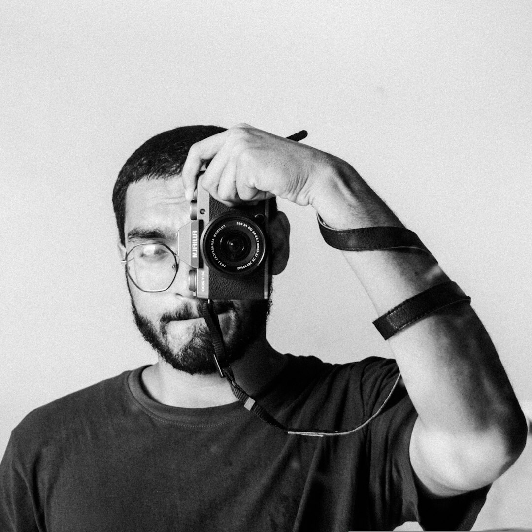 Studio portrait of a Danish male documentary photographer with a beard